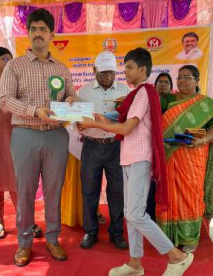 Student receiving scholarship certificate